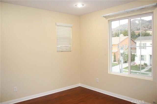 empty room featuring hardwood / wood-style floors