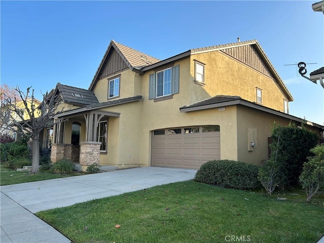 view of front of property featuring a garage and a front lawn