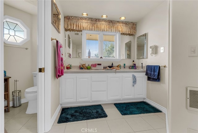 bathroom featuring tile patterned floors, vanity, and toilet