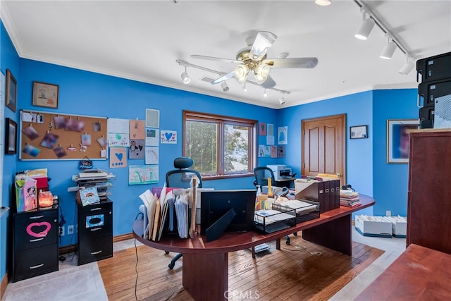 office featuring wood-type flooring, rail lighting, ceiling fan, and ornamental molding