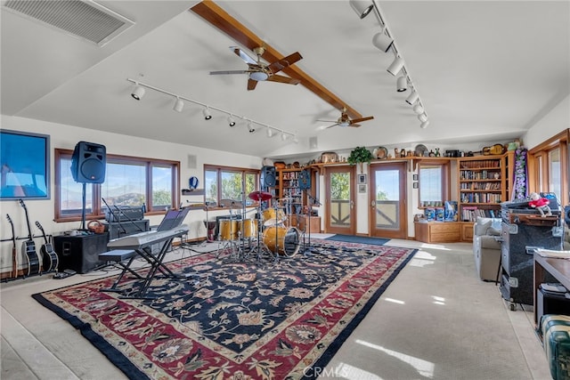 living room featuring ceiling fan, vaulted ceiling, and track lighting