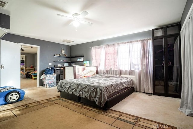 bedroom featuring concrete floors and ceiling fan