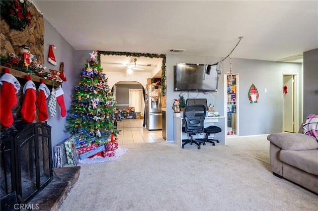 living room with ceiling fan and carpet floors