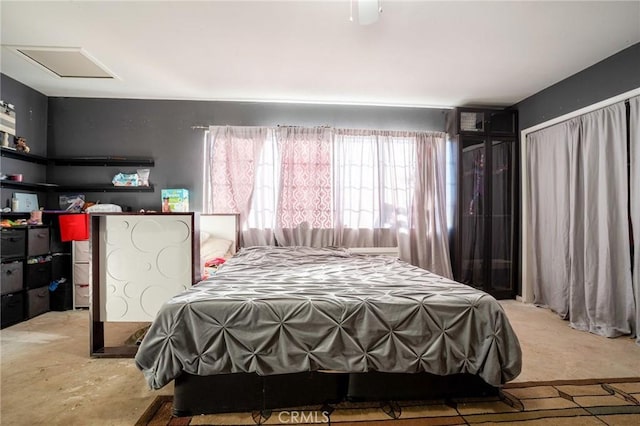 bedroom featuring ceiling fan and light carpet