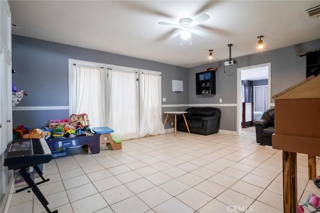 playroom featuring ceiling fan and light tile patterned flooring