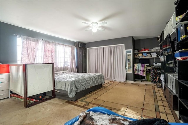 bedroom with concrete flooring and ceiling fan