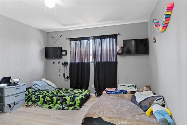 bedroom featuring light wood-type flooring