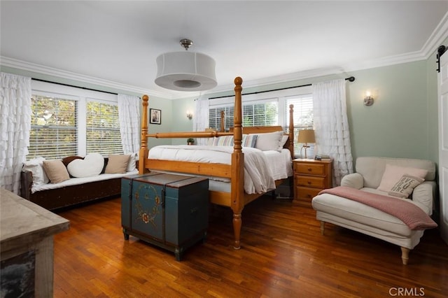 bedroom featuring dark hardwood / wood-style floors and crown molding