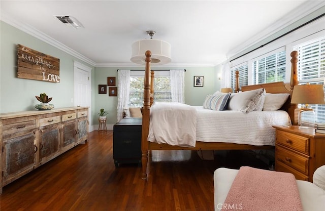 bedroom with ornamental molding, dark wood-type flooring, and multiple windows