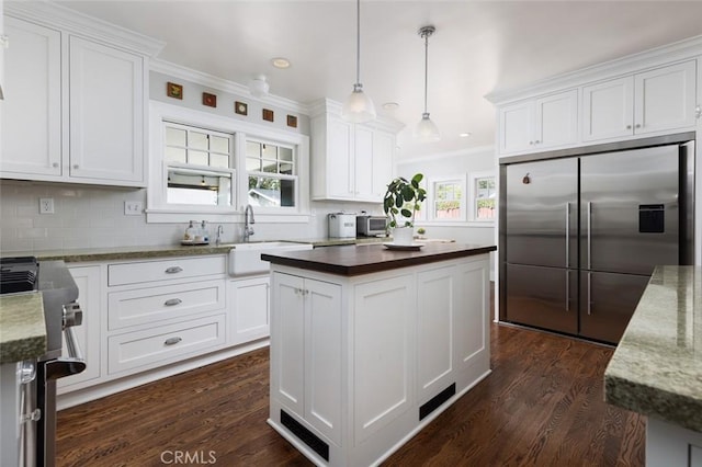 kitchen featuring white cabinets, a center island, and stainless steel refrigerator with ice dispenser