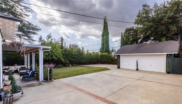 exterior space with an outdoor living space, a garage, and an outdoor structure