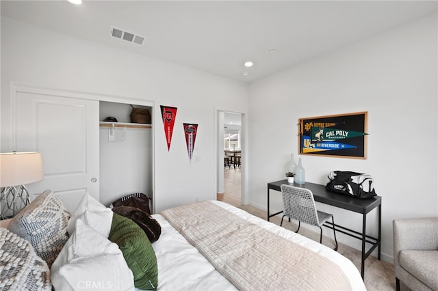 carpeted bedroom featuring a closet