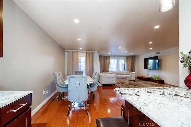 dining room with hardwood / wood-style flooring