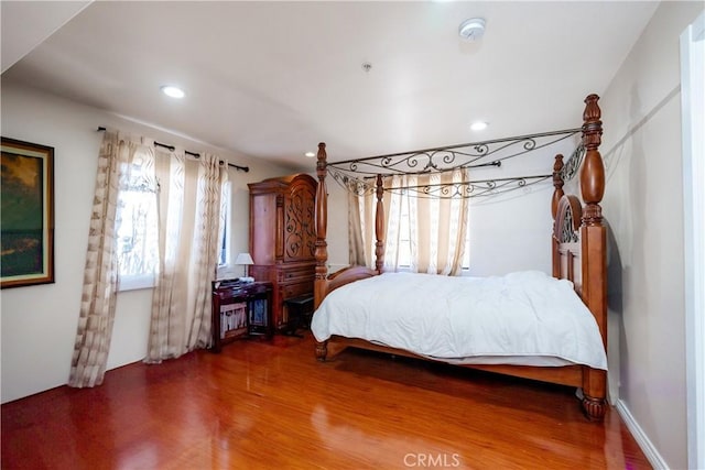 bedroom with wood-type flooring