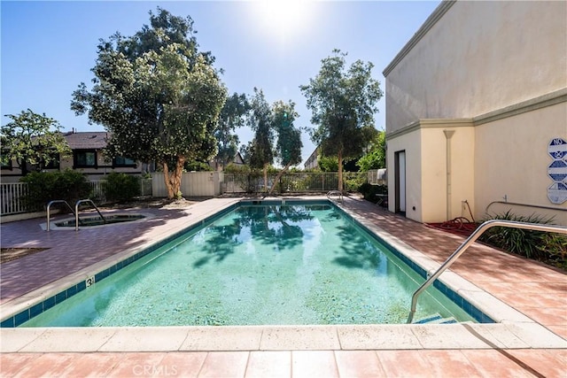 view of swimming pool featuring a patio area