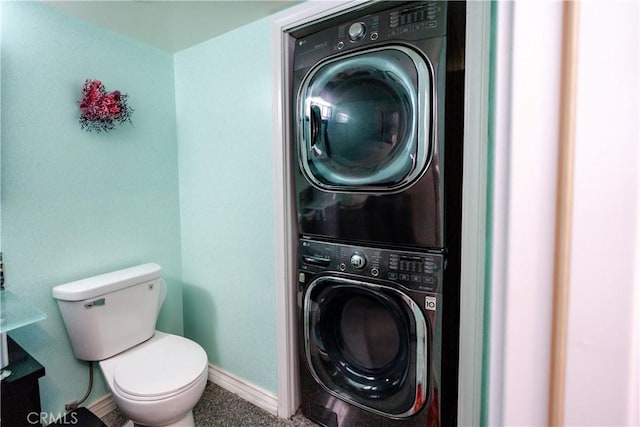 laundry area with stacked washing maching and dryer