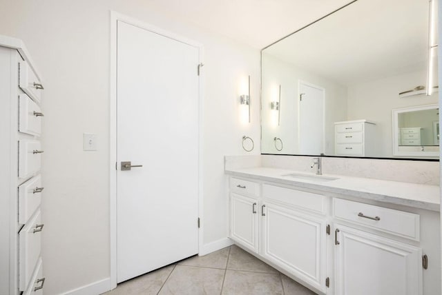 bathroom featuring tile patterned flooring and vanity