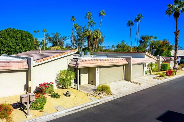 ranch-style home featuring a garage