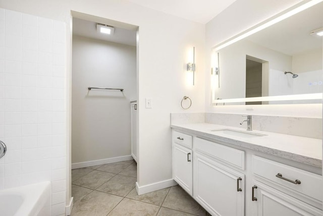 bathroom with tile patterned flooring, vanity, and  shower combination