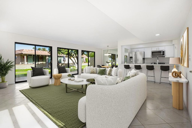 tiled living room with a healthy amount of sunlight