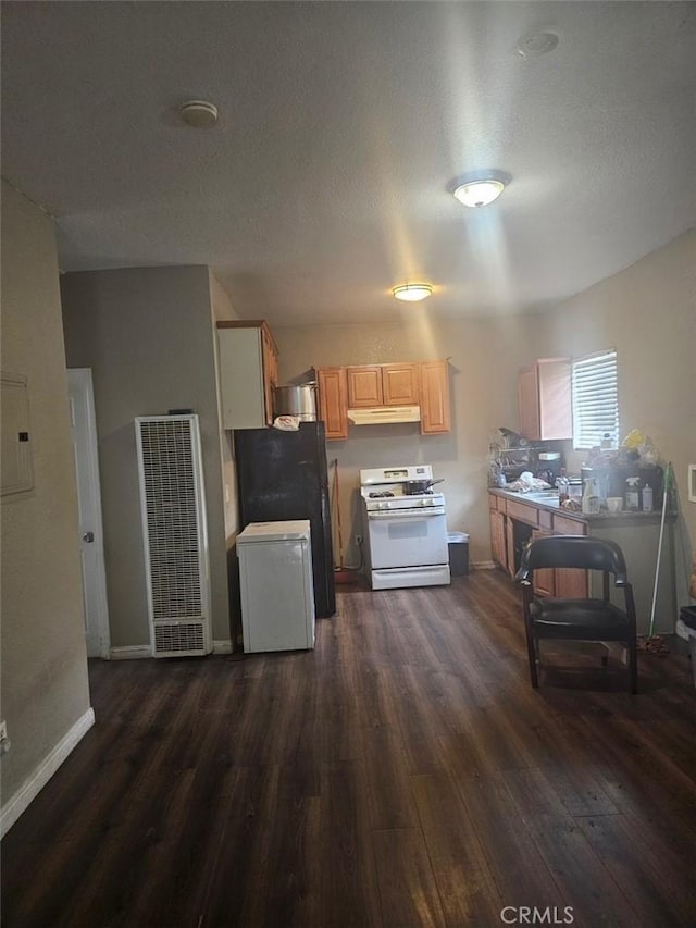 kitchen with black fridge, light brown cabinets, white range with gas stovetop, dark hardwood / wood-style floors, and fridge