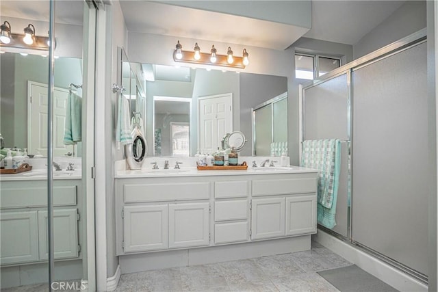 bathroom with an enclosed shower and vanity