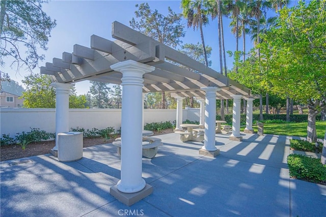 view of community with a pergola and a patio area