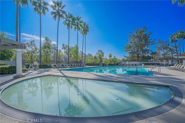 view of swimming pool featuring a patio