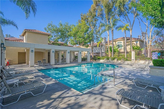 view of pool featuring a patio