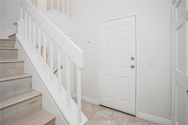 entryway featuring light tile patterned flooring