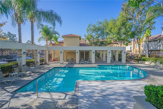 view of swimming pool with a patio