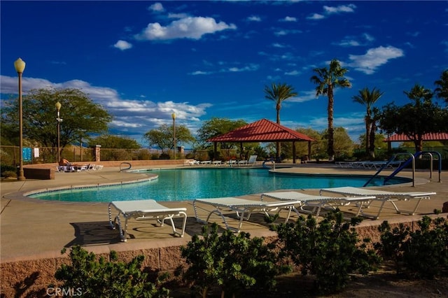 view of swimming pool with a patio