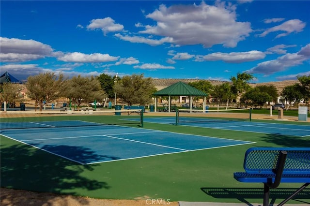 view of tennis court with a gazebo and basketball court