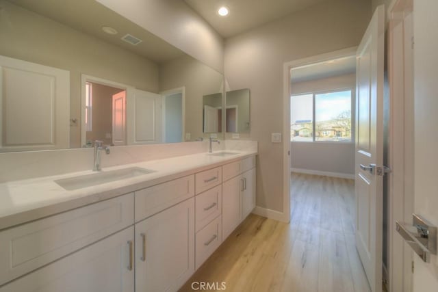 67837 Rio Vista Dr, Cathedral City, CA 92234 - full bathroom featuring wood finished floors, baseboards, double vanity, and recessed lighting