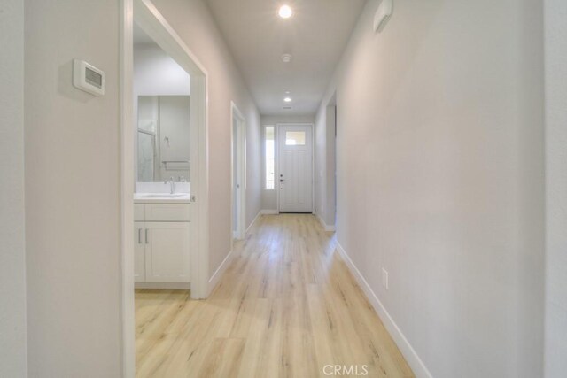 67837 Rio Vista Dr, Cathedral City, CA 92234 - hallway featuring light wood finished floors, baseboards, a sink, and recessed lighting