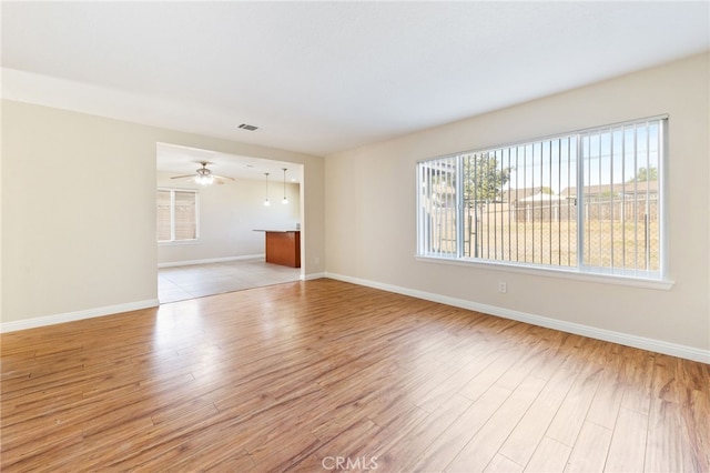 unfurnished room featuring light hardwood / wood-style floors