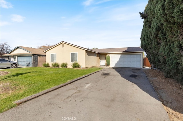 single story home with a garage and a front lawn