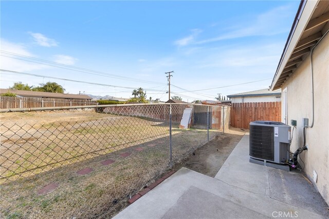 view of yard with central AC