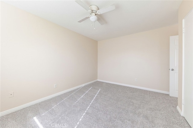 unfurnished room with ceiling fan and light carpet