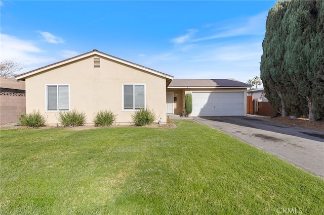 ranch-style house with a front yard and a garage