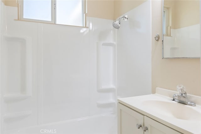 bathroom featuring shower / bathtub combination and vanity