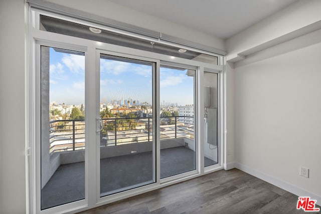 doorway to outside featuring dark hardwood / wood-style floors