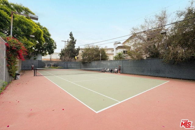 view of sport court with basketball hoop