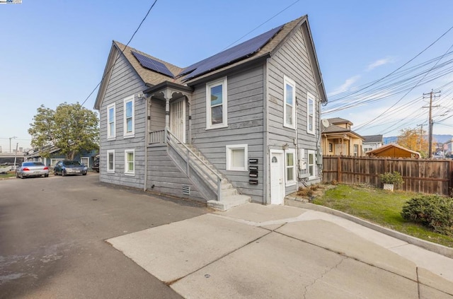 view of front of house with solar panels