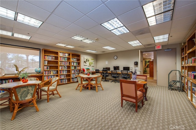 office featuring light carpet and a drop ceiling