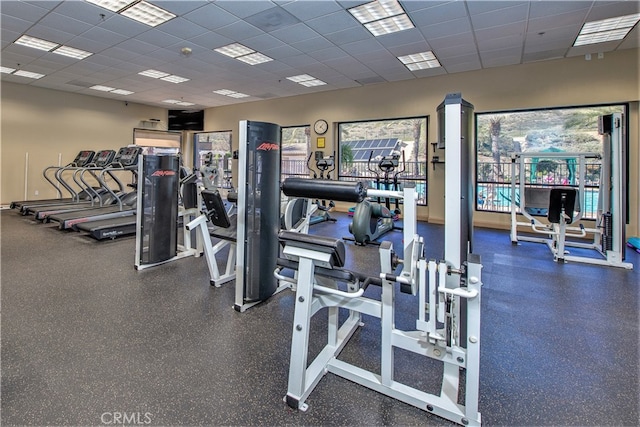 gym featuring a paneled ceiling