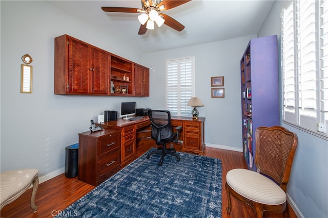 home office featuring ceiling fan and dark hardwood / wood-style flooring