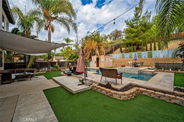 view of swimming pool with a patio area, an outdoor hangout area, an in ground hot tub, and a yard