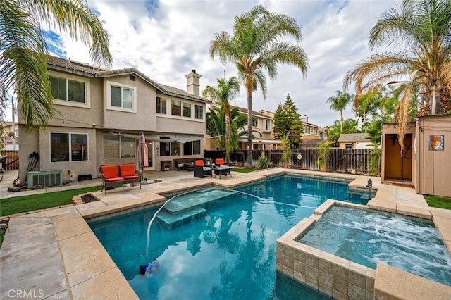 view of swimming pool with an in ground hot tub, an outdoor hangout area, cooling unit, and a patio area