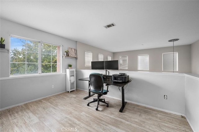 office with light hardwood / wood-style flooring